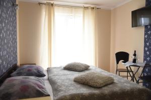 Postel nebo postele na pokoji v ubytování Nestor Centrum