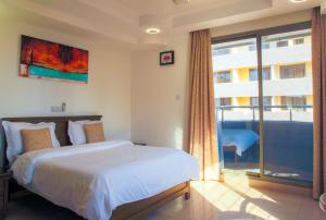 Giường trong phòng chung tại Sleep Inn Hotel - City Centre