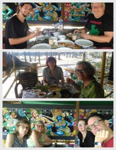a group of people sitting around a table at Cherai Ocean View Home in Cherai Beach +58 photos