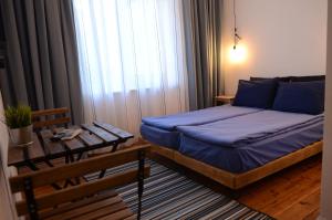 A bed or beds in a room at Generaator Sofia