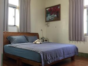 Postel nebo postele na pokoji v ubytování Fu Courtyard Homestay