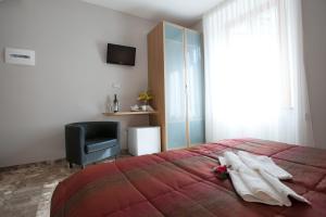 Rúm í herbergi á Affittacamere Da Paulin