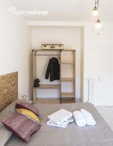 Posteľ alebo postele v izbe v ubytovaní PizzaSleep -apartment-