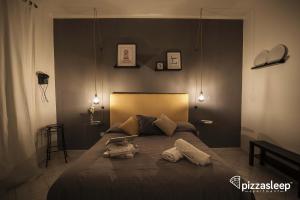 Posteľ alebo postele v izbe v ubytovaní PizzaSleep -apartment-