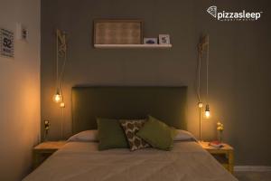 Posteľ alebo postele v izbe v ubytovaní PizzaSleep -apartment-