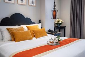 Postel nebo postele na pokoji v ubytování Sanouva Saigon Hotel