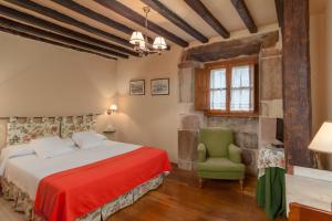 Postel nebo postele na pokoji v ubytování Casona De La Salceda