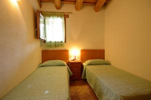 Postel nebo postele na pokoji v ubytování Apartamento en pleno Montseny Mas Romeu Turisme Rural