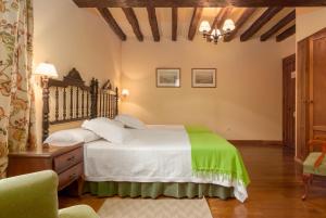 Postel nebo postele na pokoji v ubytování Casona De La Salceda
