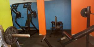 a gym with two exercise bikes in a room at Hôtels Résidences Easy in Cotonou