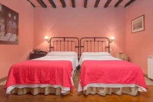 Postel nebo postele na pokoji v ubytování Casona De La Salceda
