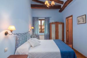 Postel nebo postele na pokoji v ubytování Casona De La Salceda