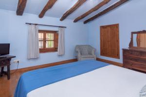 Postel nebo postele na pokoji v ubytování Casona De La Salceda