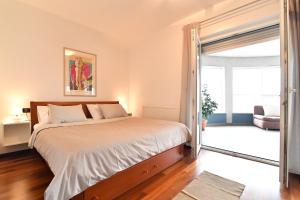 Postel nebo postele na pokoji v ubytování City penthouse Vita