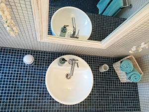 Ванная комната в Maison Angulus Ridet
