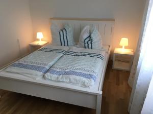 Ein Bett oder Betten in einem Zimmer der Unterkunft Apartmenthaus Schwielowsee