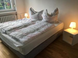 Ein Bett oder Betten in einem Zimmer der Unterkunft Apartmenthaus Schwielowsee