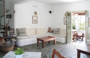 a living room with a couch and a table at Vidalis Hotel in Kionia