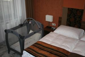 Ένα ή περισσότερα κρεβάτια σε δωμάτιο στο Hotel BELASSI