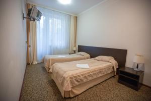 
Кровать или кровати в номере Гостиница "Шале-Спорт" Красноармейск
