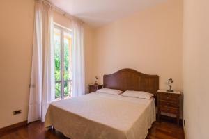 A bed or beds in a room at Villa La Quiete