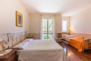 A bed or beds in a room at Villa La Quiete