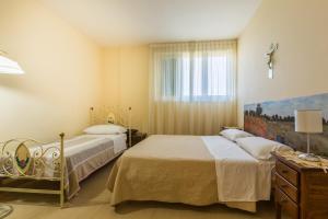 A bed or beds in a room at Villa La Quiete Még 25 kép