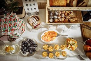 a table topped with lots of different types of food at Optima Collection Zhytomyr in Zhytomyr