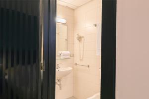 Koupelna v ubytování Executive Business Hotel + 33 fotografií