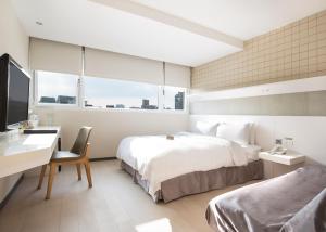 Postel nebo postele na pokoji v ubytování Dandy Hotel - Tianmu Branch