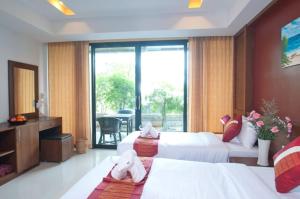 Letto o letti in una camera di Samui Honey Suite