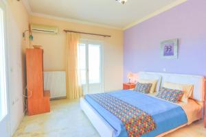 Postel nebo postele na pokoji v ubytování Villa Eftihia