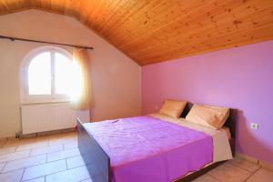 Postel nebo postele na pokoji v ubytování Villa Eftihia
