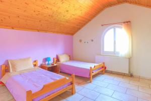 Postel nebo postele na pokoji v ubytování Villa Eftihia