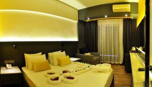 Un pat sau paturi într-o cameră la Oba Star Hotel - Ultra All Inclusive