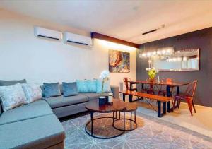 a living room with a couch and a table at Pacheco Oasis in Cebu City
