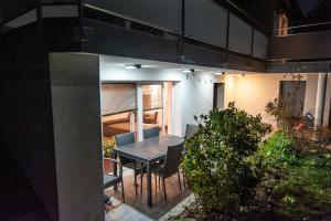 a house with a table and chairs on a patio at Apartment Dolce Vita in Celje