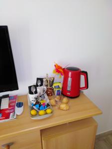 a desk with a red coffee pot on top of a desk at DIVA in Roquebrune-sur-Argens
