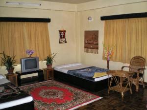 Voodi või voodid majutusasutuse Planet Bhaktapur Hotel toas