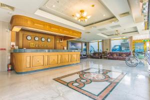 a large lobby with a bar with a snake on the floor at Foung Jia Hotel in Magong