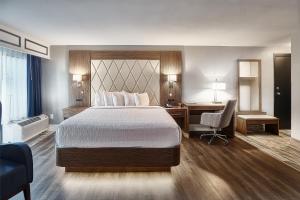 Postelja oz. postelje v sobi nastanitve Grand Hilton Head Inn, Ascend Hotel Collection