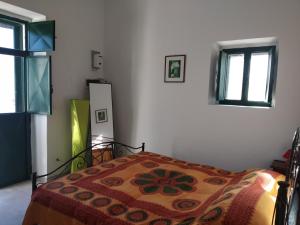 Postel nebo postele na pokoji v ubytování Physis b&b-a casa di Clio