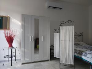 Postel nebo postele na pokoji v ubytování Physis b&b-a casa di Clio