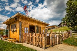 a small building with a fence in front of it at Praschhof in Mariapfarr