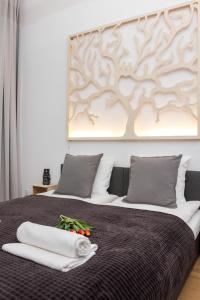 Łóżko lub łóżka w pokoju w obiekcie Oasis by Cozyplace