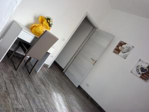 a room with a staircase and a table and a cabinet at Il Panorama in Sinalunga