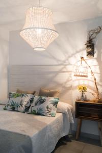 A bed or beds in a room at Hostal Sa Malica