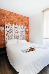 Cama o camas de una habitación en HOMEABOUT SAN BERNARDO Apartment I