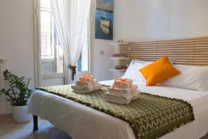 En eller flere senge i et værelse på La casa al Baglio