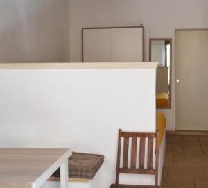 a dining room with a table and a chair at Residence Lion in San Vito lo Capo